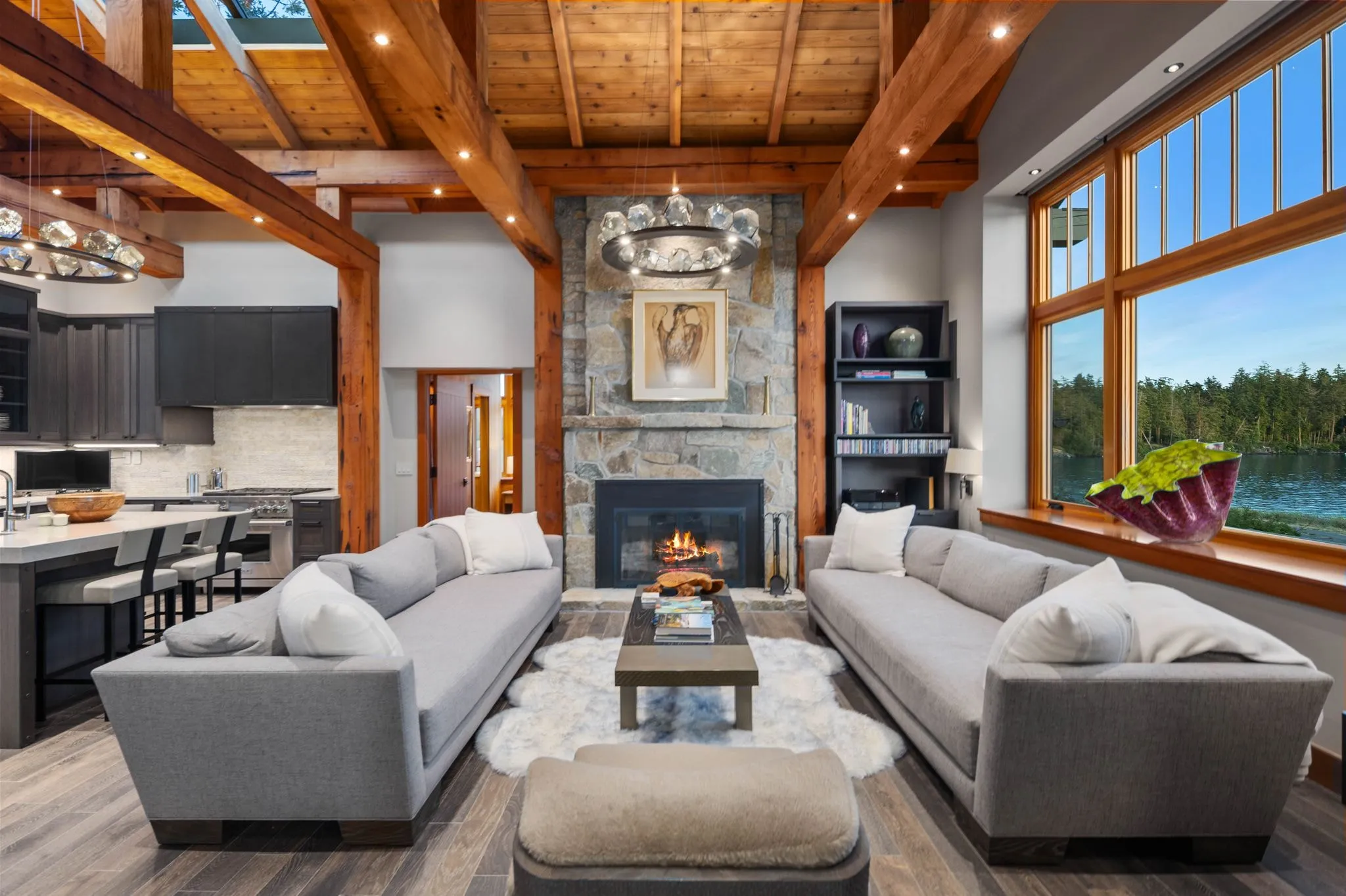 Great room with a timber ceiling filmed for a real estate video tour by ACRE Seattle